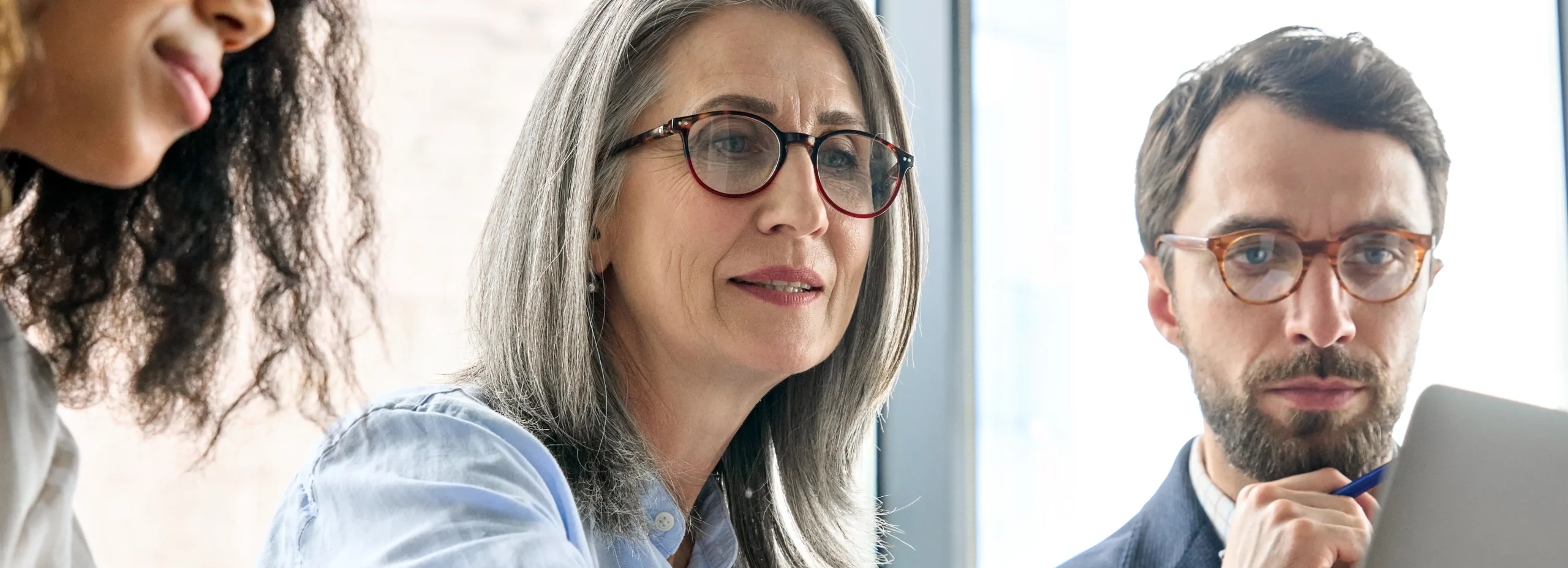 Person researching Google trends scraping data on laptop with Google homepage for keyword analysis