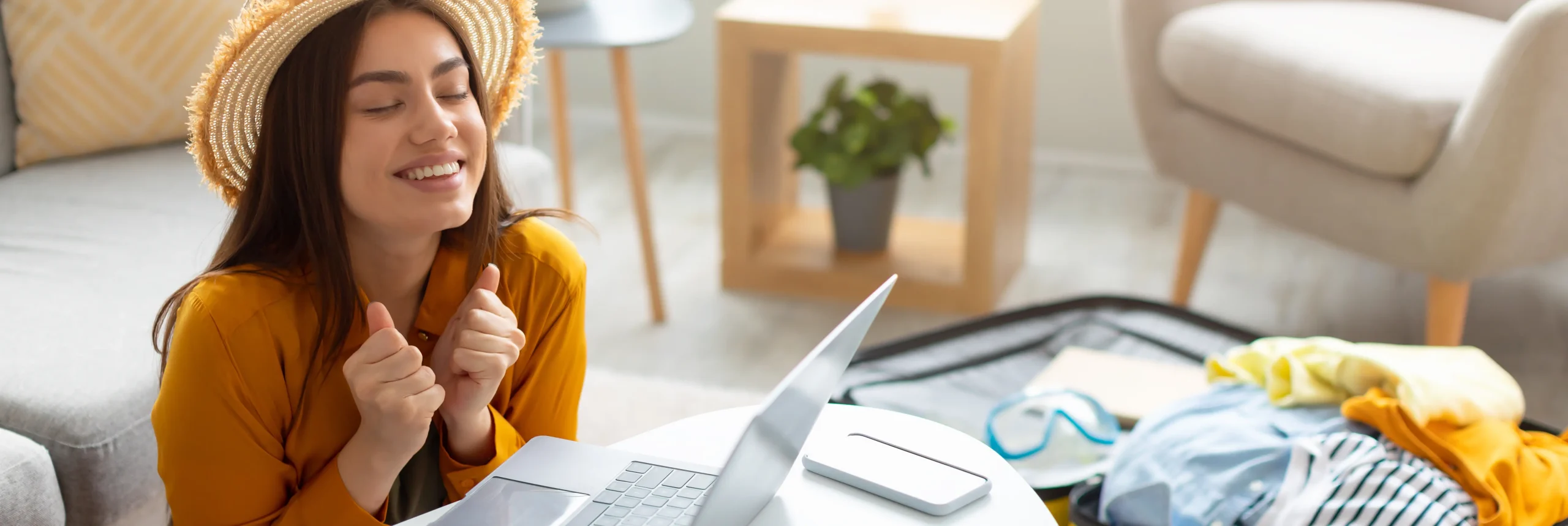 Woman planning travel with laptop using TripAdvisor data scraping for destination research and trip preparation